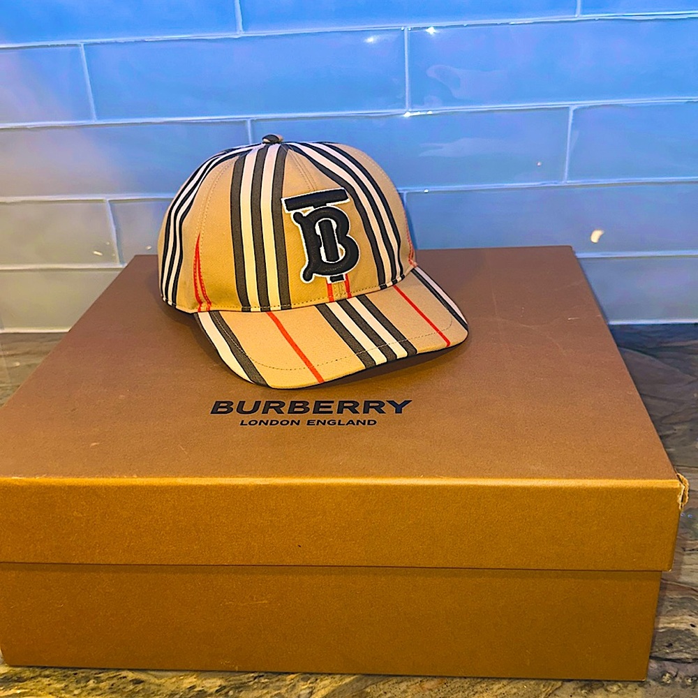Burberry hat NEVER USED. Brand new comes with two dust bags and box.